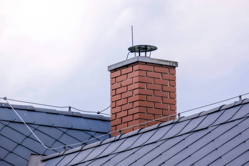 Brick chimney stack on a slate roof